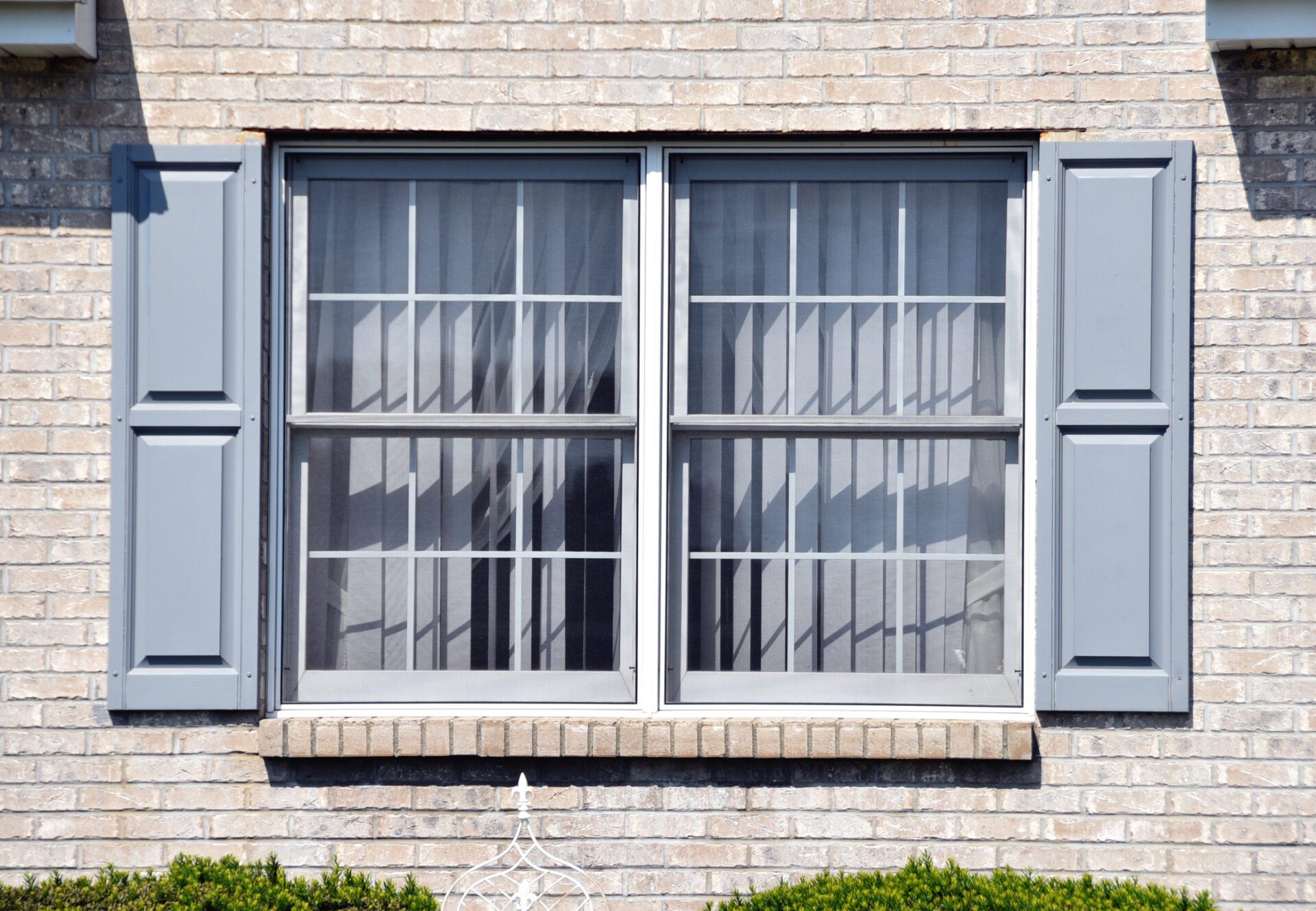 Window with Gray Shutters Single and Double-Hung Windows