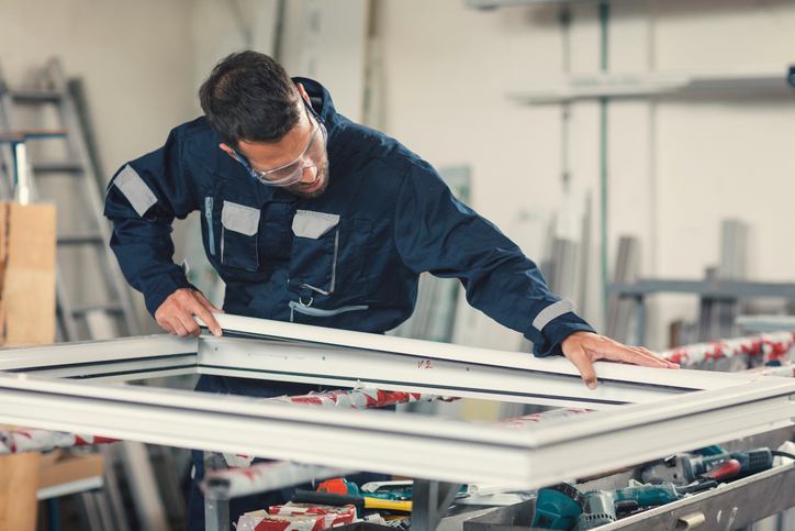 Technician working on a window frame Technician working on a window frame